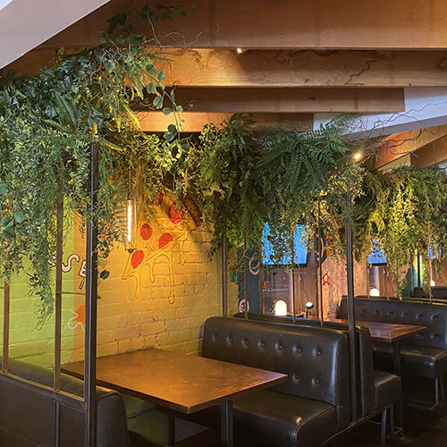 commercial artificial foliage installation in bar booth case study