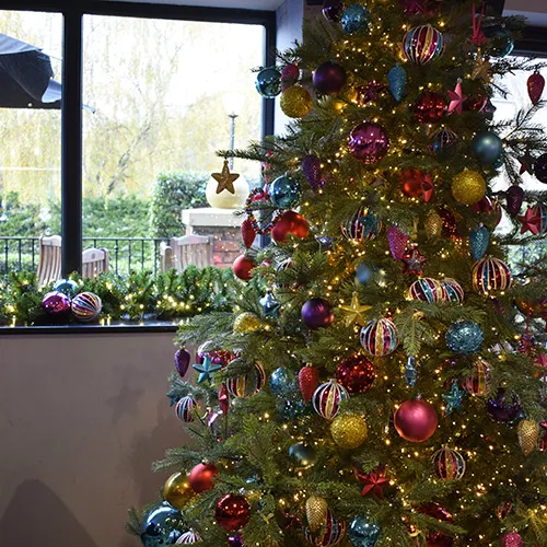bespoke mulitcoloured bauble and decoration on tree in hotel