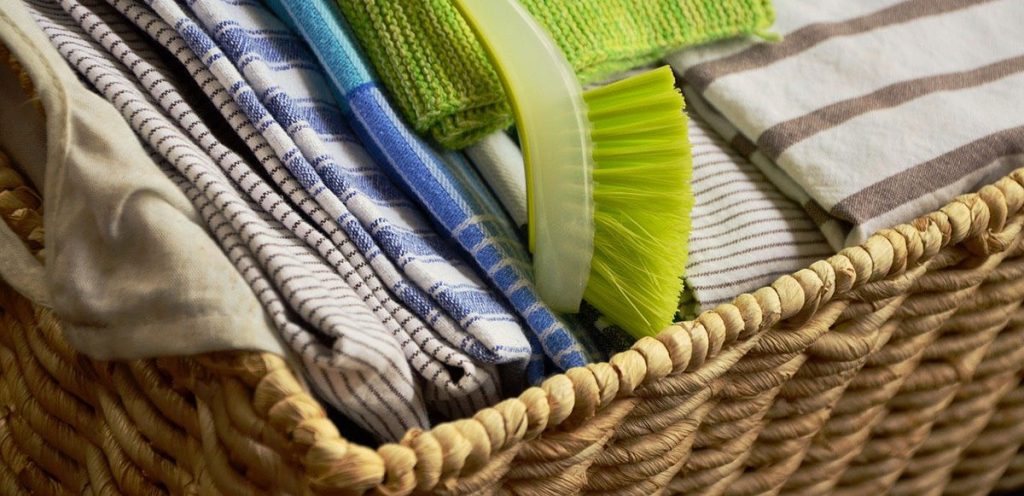 how to use baskets for storage in the kitchen - tea towels and brush