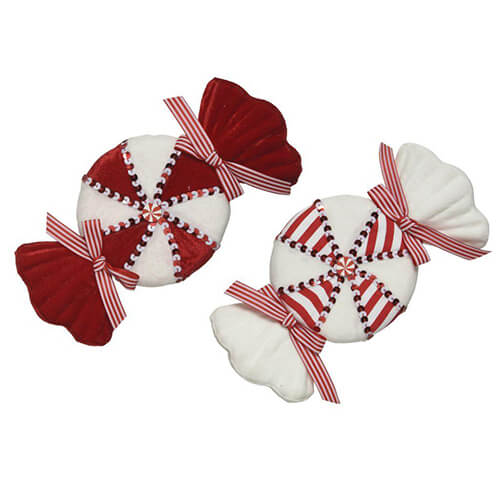 Two red and white sweets in wrappers decorations with bows