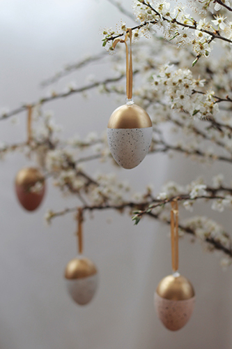 easter egg decorations hanging on blossom branches