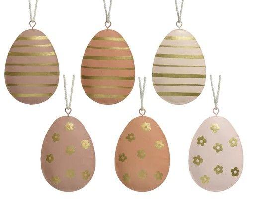 hanging metal egg decorations in neutral and gold designs