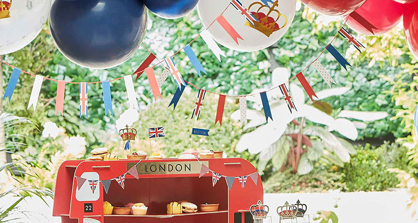 london bus cake stand, coronation party balloons and bunting