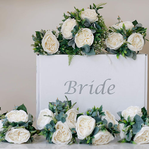 white roses - artificial flowers for weddings on a box that says bride