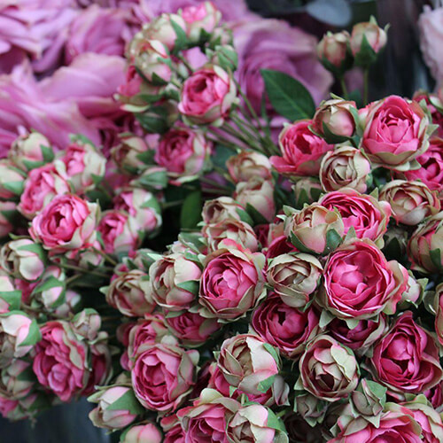 large bunch of pink and green artificial rose buds