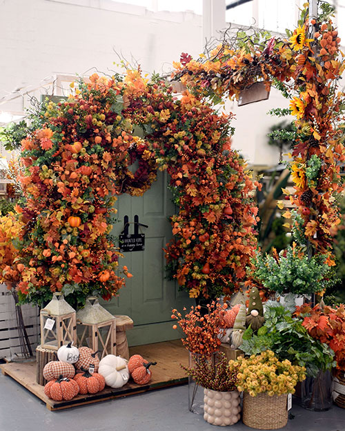 autumn decorating idea artificial foliage door arch