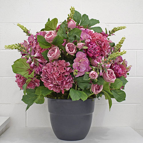 pink bespoke corporate artificial flower arrangement in grey pot