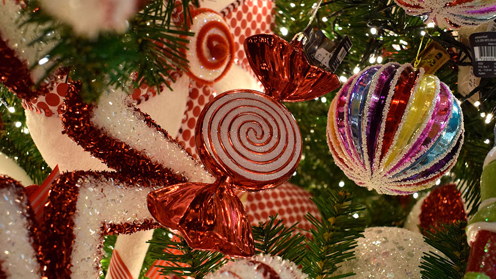 striped multicoloured bauble, red and white sweet decoration in wrapper and star decoration