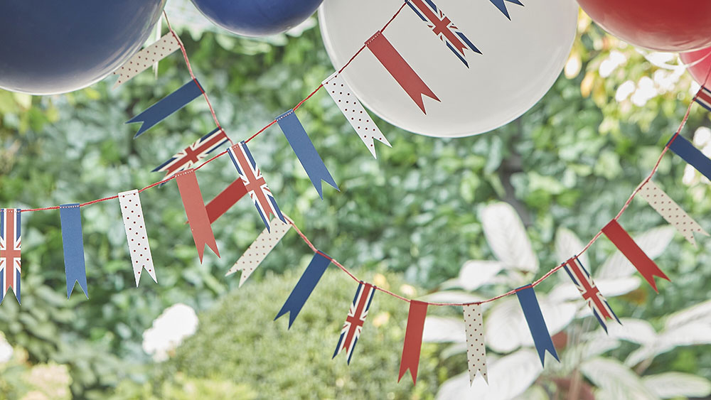 red, white and blue kings coronation bunting with union jack flags