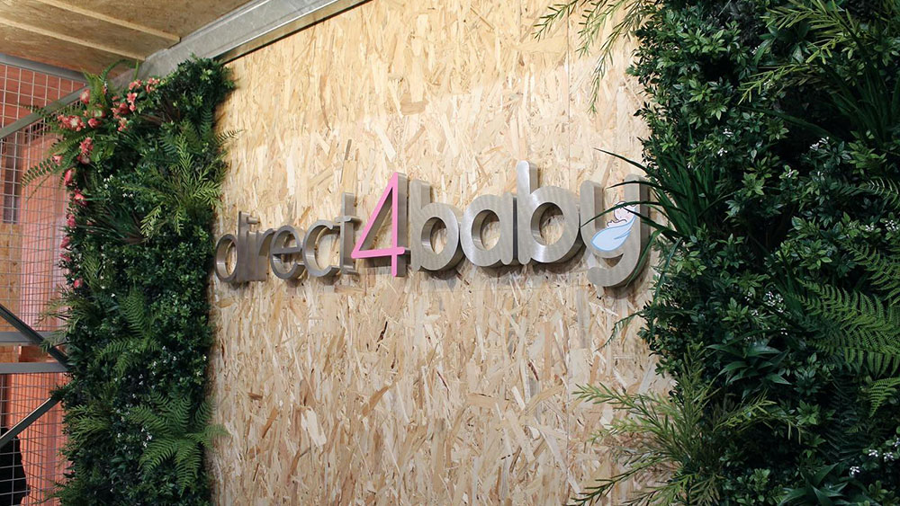 retail interior design with artificial living wall around direct 4 baby sign
