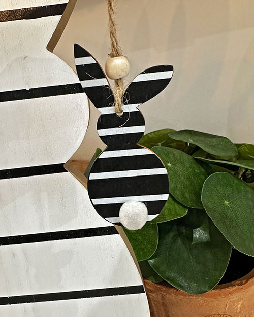 hanging black and white striped bunny easter decoration with faux plant