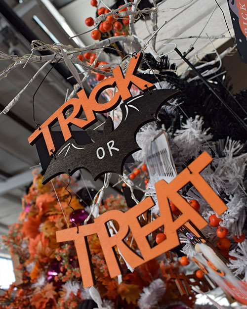 trick or treat halloween sign with bat
