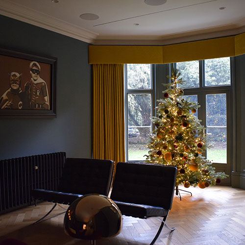 dark blue lounge with yellow curtain contemporary furniture and christmas tree