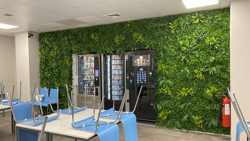 artificial living wall installation around vending machines in an office canteen