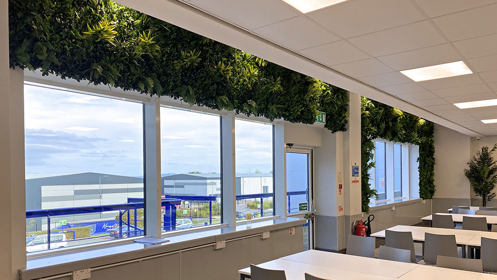 factory office artificial living wall above windows