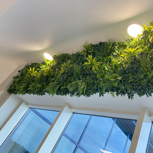 faux living wall installation above office window