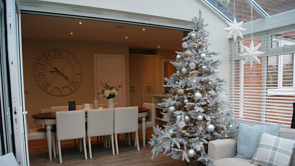 christmas decorating service in a show home conservatory with white christmas tree