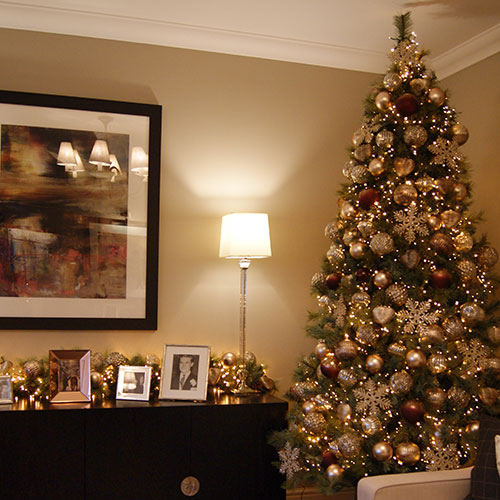 luxurious gold and brown decorated christmas tree in show home lounge