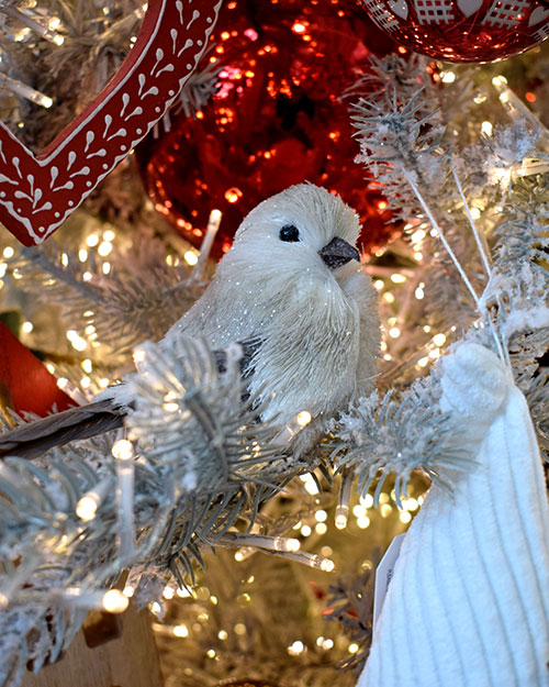 scandi christmas tree decorations with white bird in tree