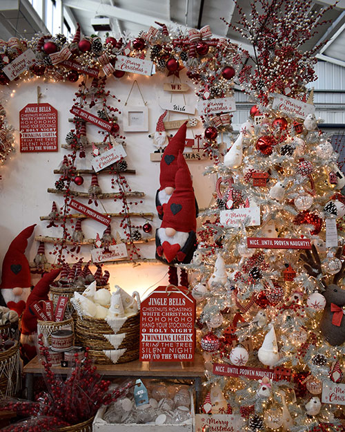selection of red and grey gonks with signs and scandi christmas decorations