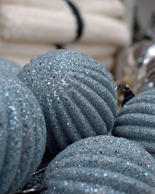 close up of sparkly icy blue baubles