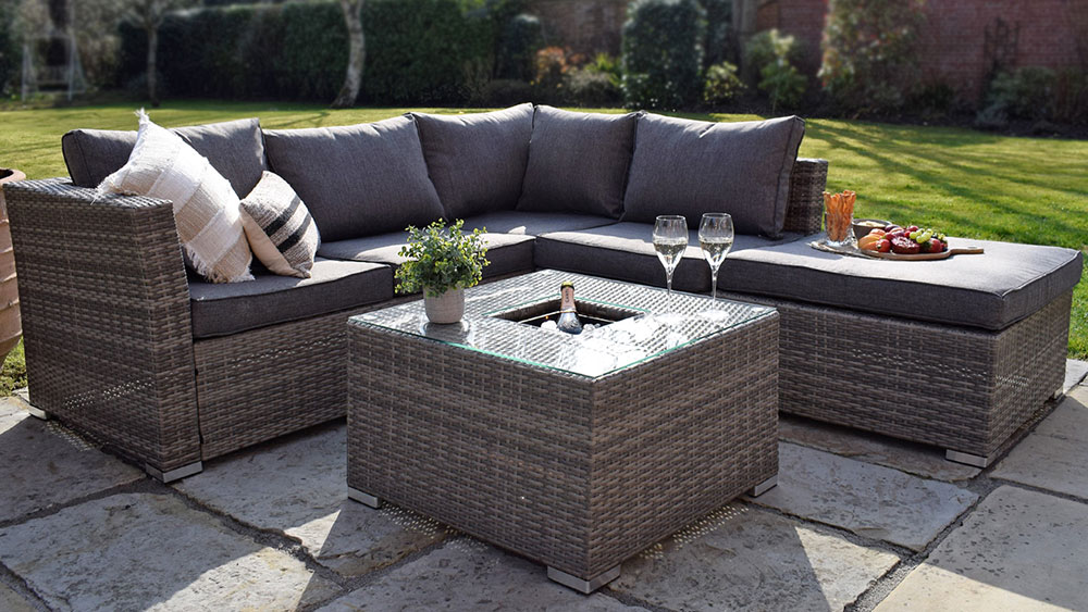 grey outdoor rattan corner sofa and coffee table with integrated ice bucket