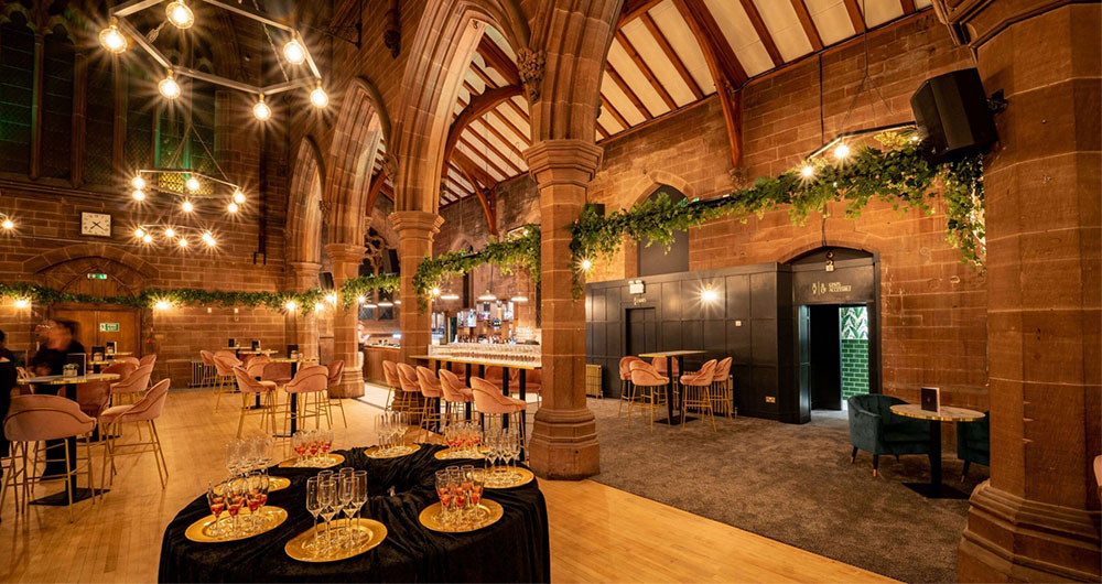 the guild chester bar interior design faux foliage installation to compliment arches of former church building