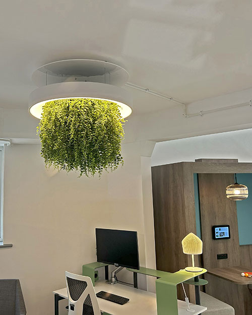commercial faux plant foliage light feature above desk