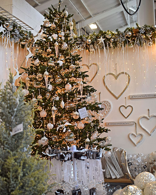 white christmas theme tree with icicles, display with garland and heart decorations