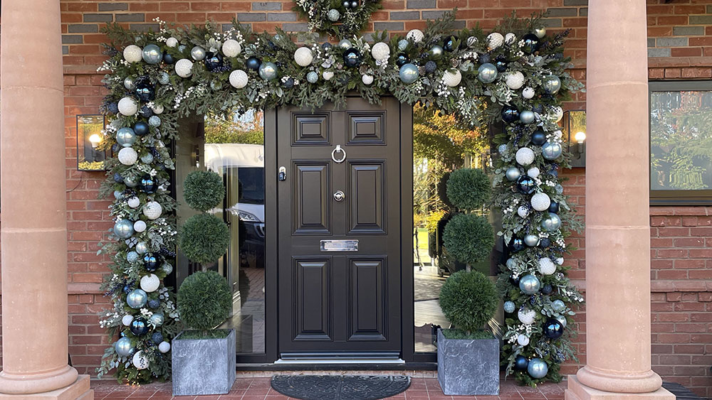 wirral residential christmas decorating service large door garland with icy blue, dark blue and white baubles