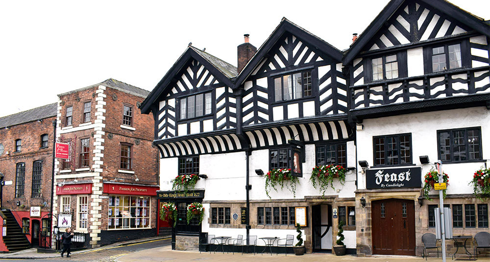 Ye Olde Kings Head Inn in Chester with bespoke artificial flower hanging baskets and troughs